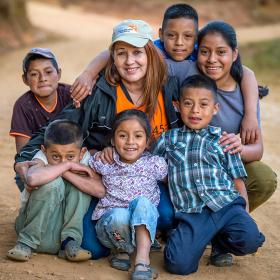 World Vision staff member with children in Honduras