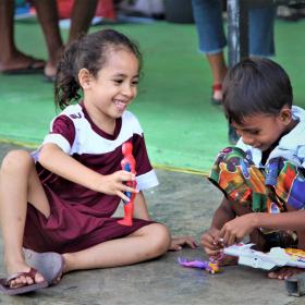 Leli is playing with her new friend in refugee camp. Photo: Anita Marques/World Vision. 07 April 2021.