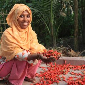 Women's economic empowerment - woman holding chillies