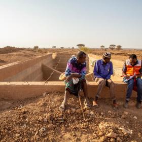 WVI staff speaks with villagers
