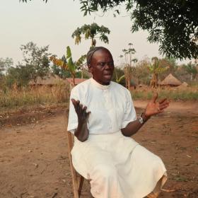 man sits outside and prays